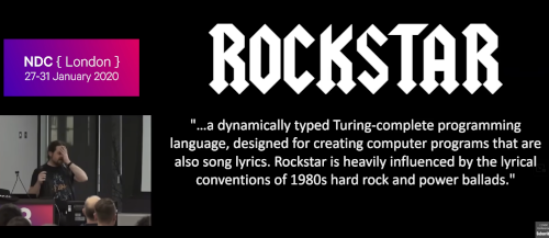 Screenshot of Dylan&rsquo;s talk, with him in the corner and &lsquo;ROCKSTAR: &hellip;a dynamically typed Turing-complete programming language, designed for creating computer programs that are also song lyrics. Rockstar is heavily influenced by the lyrical conventions of 1980s hard rock and power ballads.&rsquo; written in a metal font in his presentation.